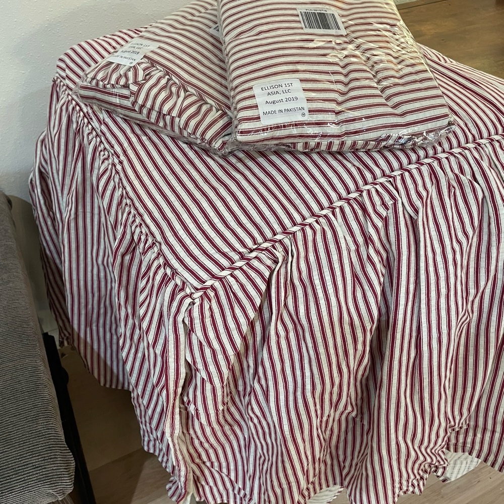 Full comforter and two pillow shams. Red and white striped. Never used.